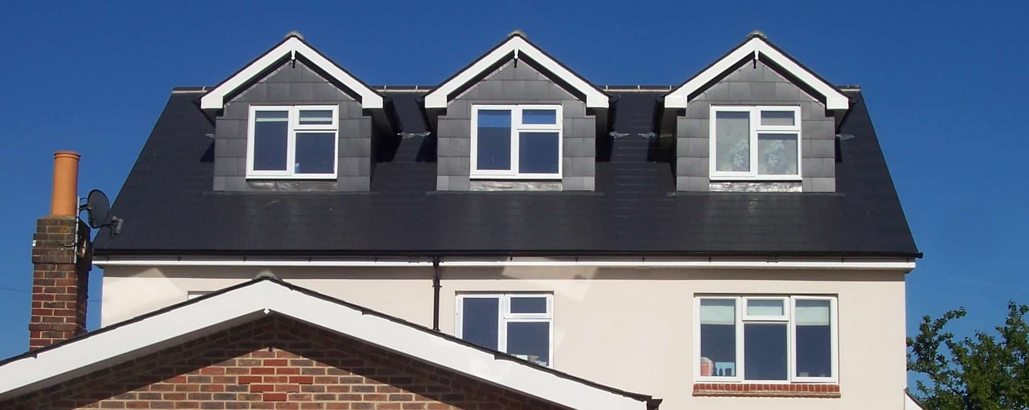 Detached house in Portsmouth loft conversion and side extension with slate dormers to front and rear elevations