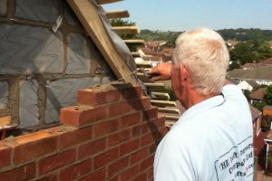 Bricklayer constructing loft conversion gable wall in Drayton, Portsmouth