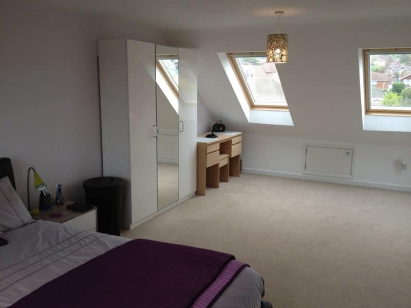 Loft conversion to a semi detached house. Front elevation Velux roof windows. Rear elevation flat roof dormer. Side elevation gable wall construction. 1 bedroom to loft conversion with en-suite shower room. Staircase positioned above existing and oak handrail.