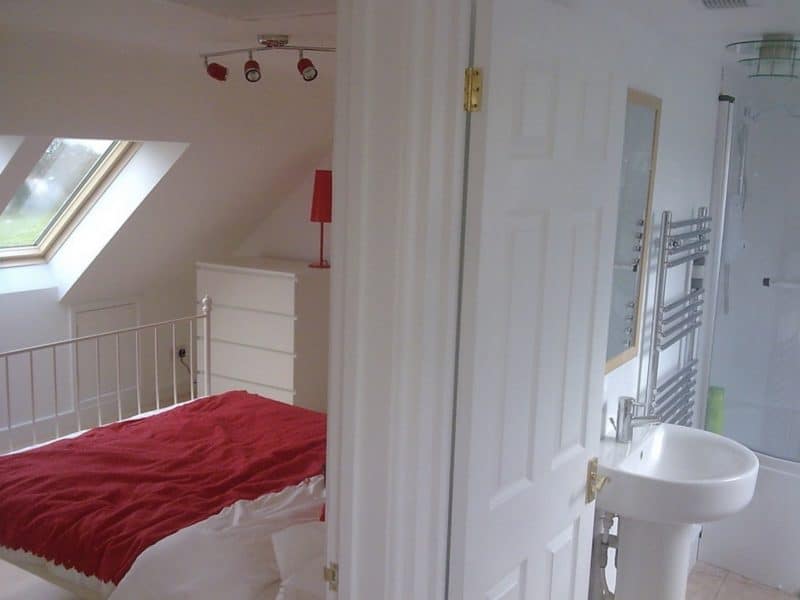 A loft conversion to a large detached bungalow bedroom with family bathroom. Velux windows to front, rear elevations