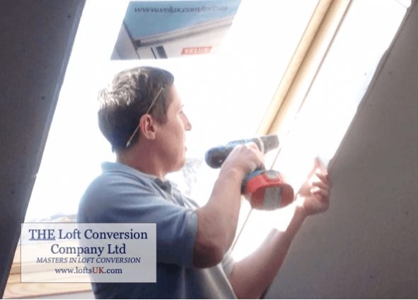 A loft conversion in Portsmouth carpenter fitting Velux window.