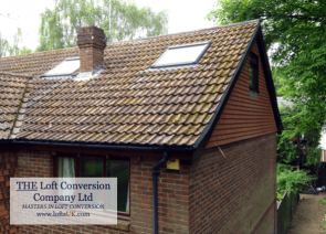 A loft conversion to a 3 bedroom house displaying the side elevation gable wall built in timber and tile hung with plain concrete tiles.