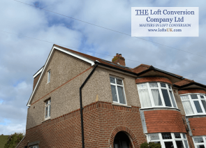 A loft conversion with a glass gable wall construction in the Portsmouth area.